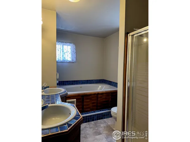 a kitchen with a stove a refrigerator and a sink