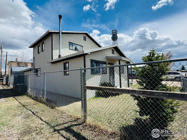 a kitchen with a refrigerator and a sink