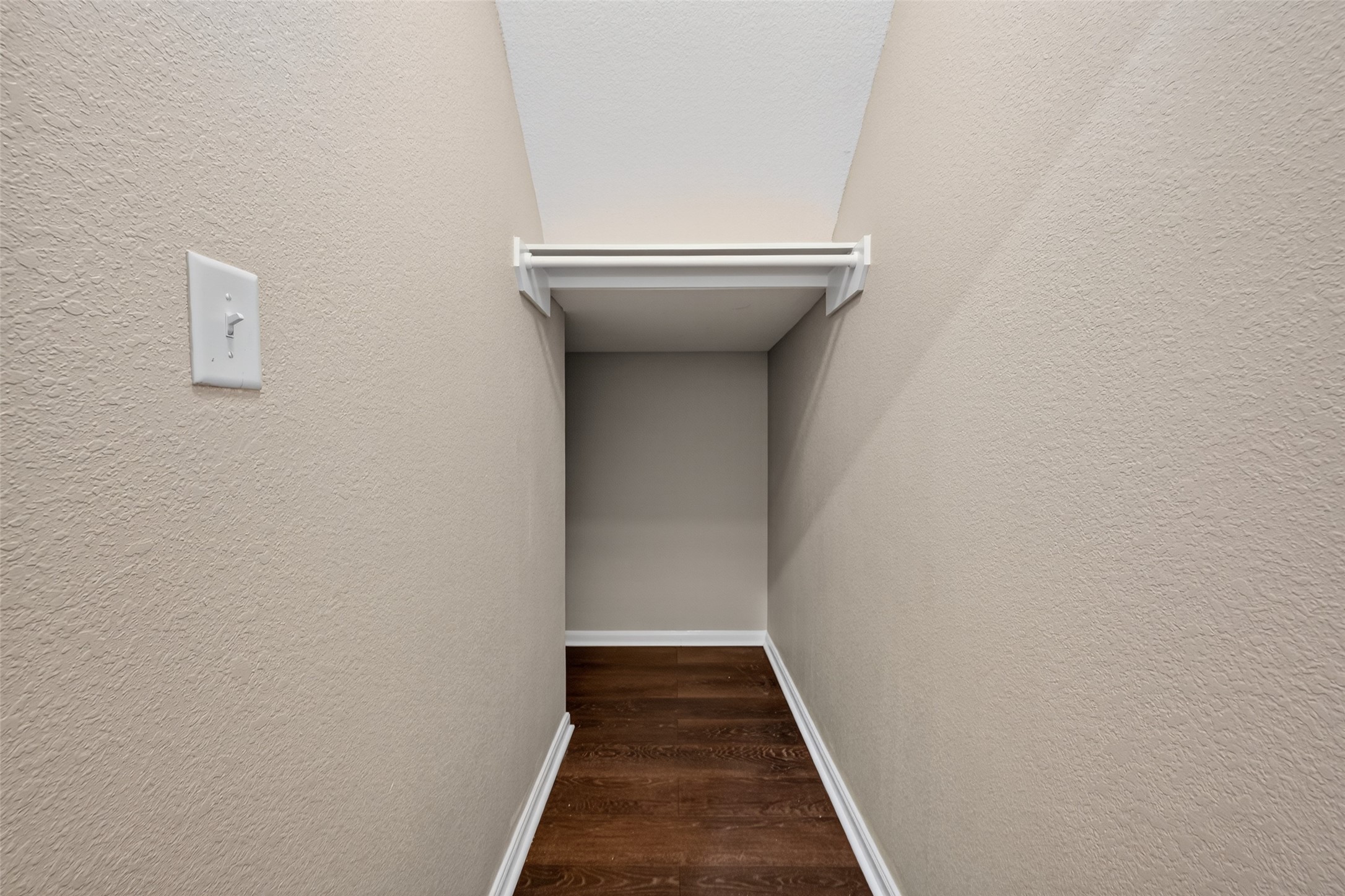 25403 King Reyes Street Katy, TX 77493 - Photo 14 of 27 a view of a hallway with wooden floor and a white door