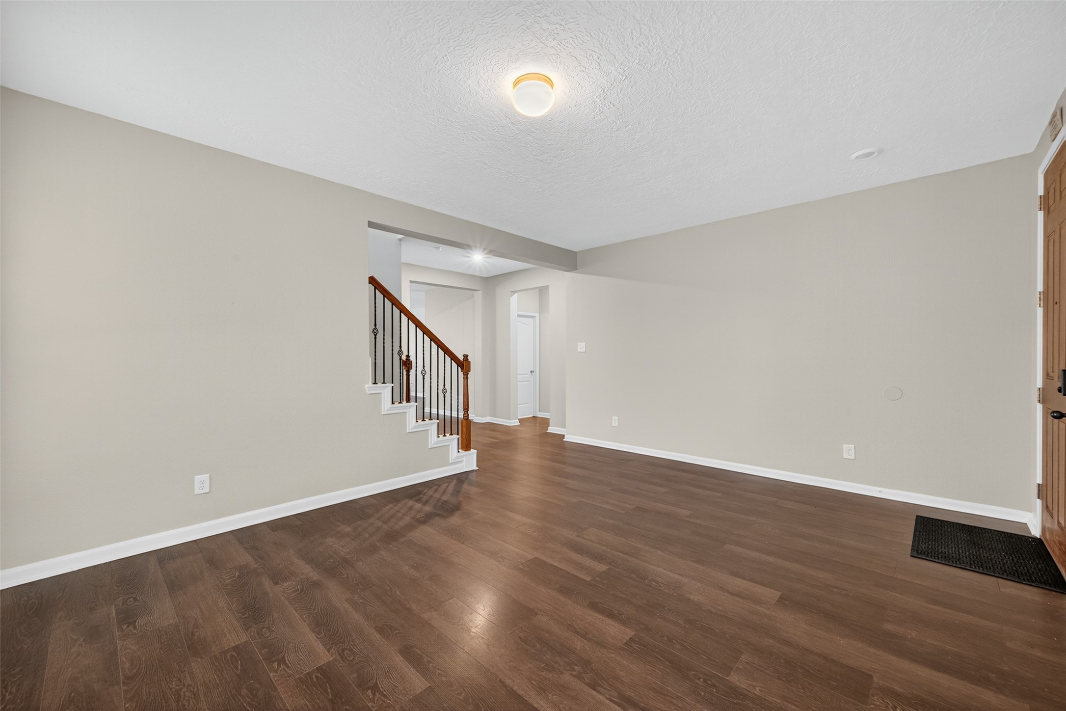 25403 King Reyes Street Katy, TX 77493 - Photo 16 of 27 a view of an empty room with wooden floor