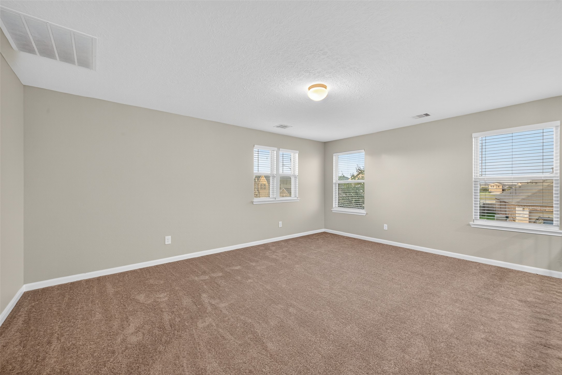 25403 King Reyes Street Katy, TX 77493 - Photo 18 of 27 a view of an empty room with a window