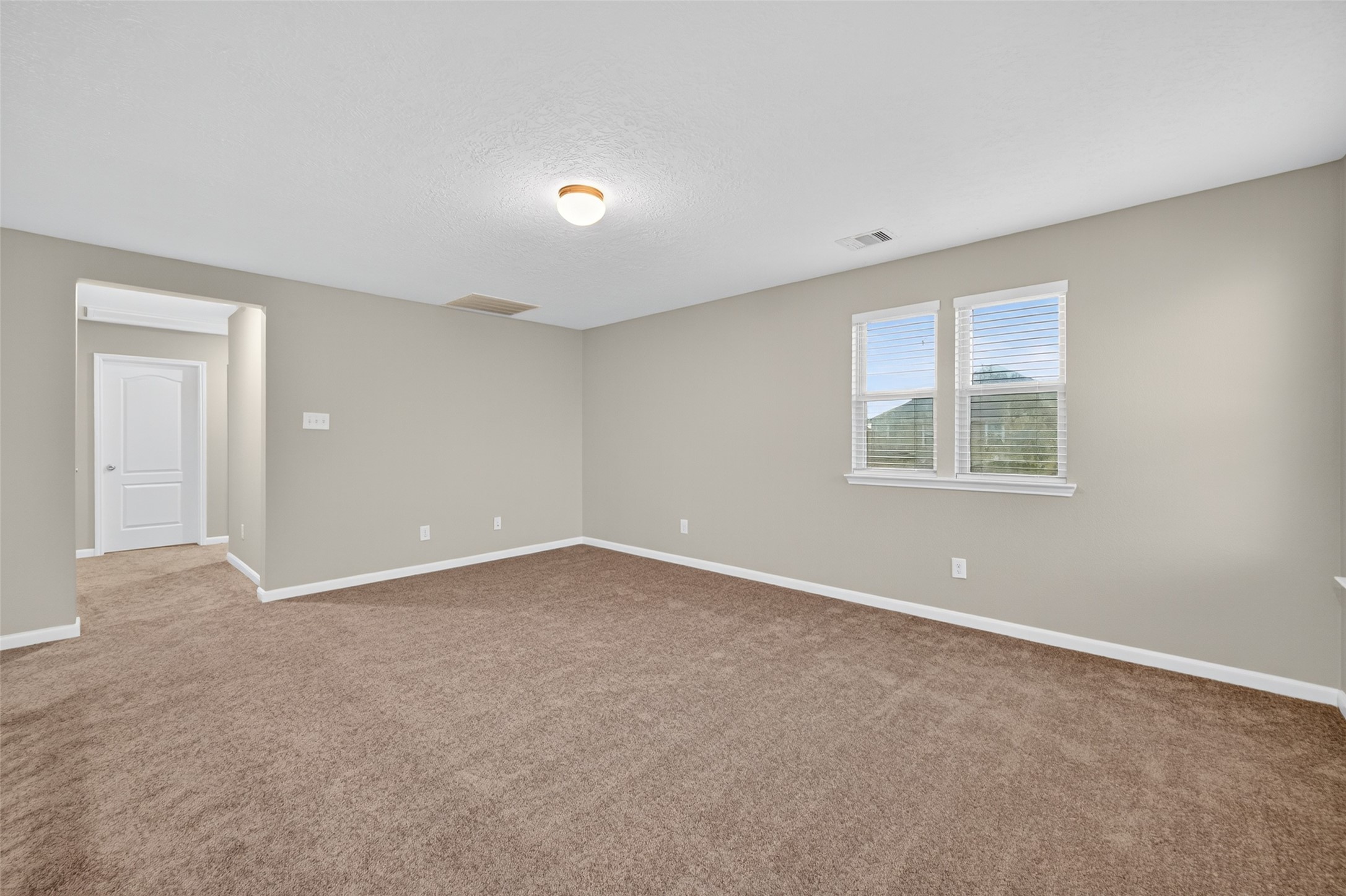 25403 King Reyes Street Katy, TX 77493 - Photo 21 of 27 an empty room with a window