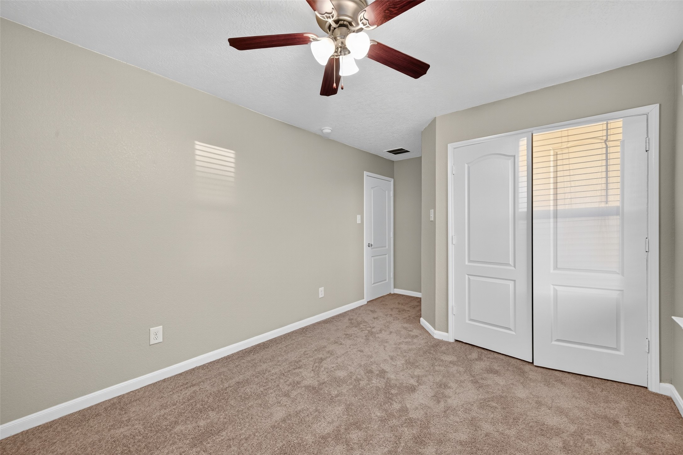 25403 King Reyes Street Katy, TX 77493 - Photo 22 of 27 an empty room with chandelier fan