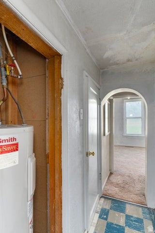 482 West 100 N Street Beaver, UT 84713 - Photo 14 of 41 Hallway to back bedroom with closet for electric water heater and arched walkways