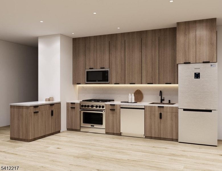 a kitchen with a stove and a refrigerator