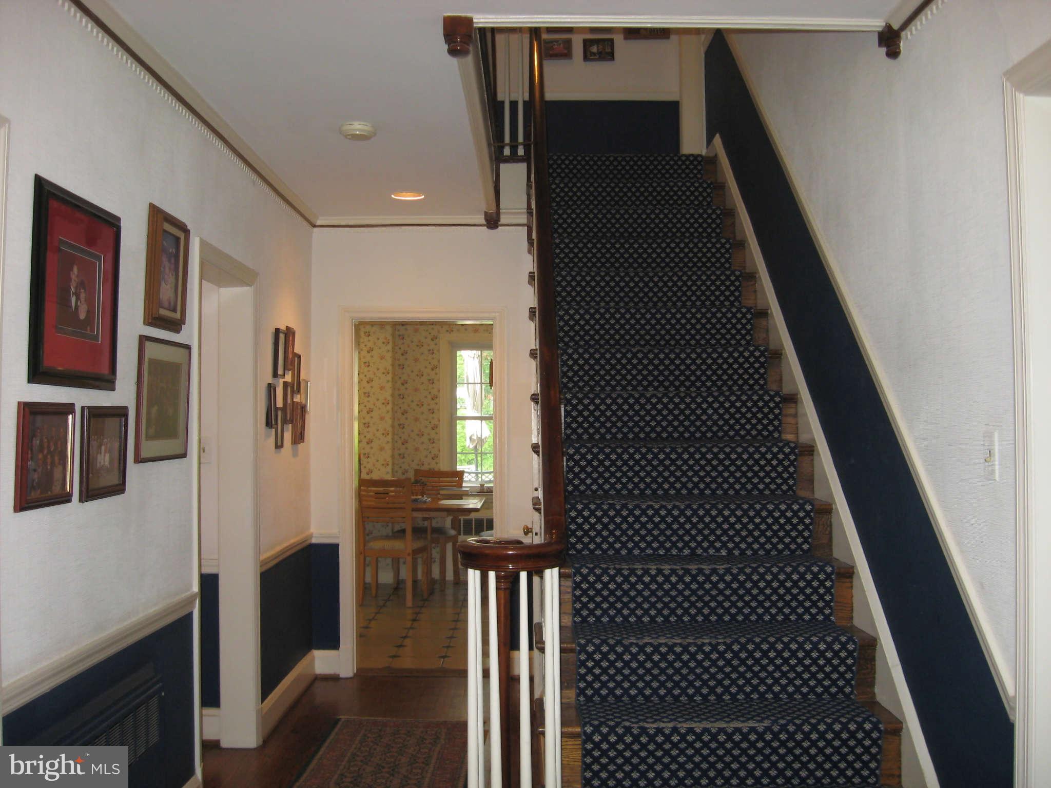 3224 Fallstaff Road Baltimore, MD 21209 - Photo 3 of 17 a view of a hallway with wooden floor and staircase