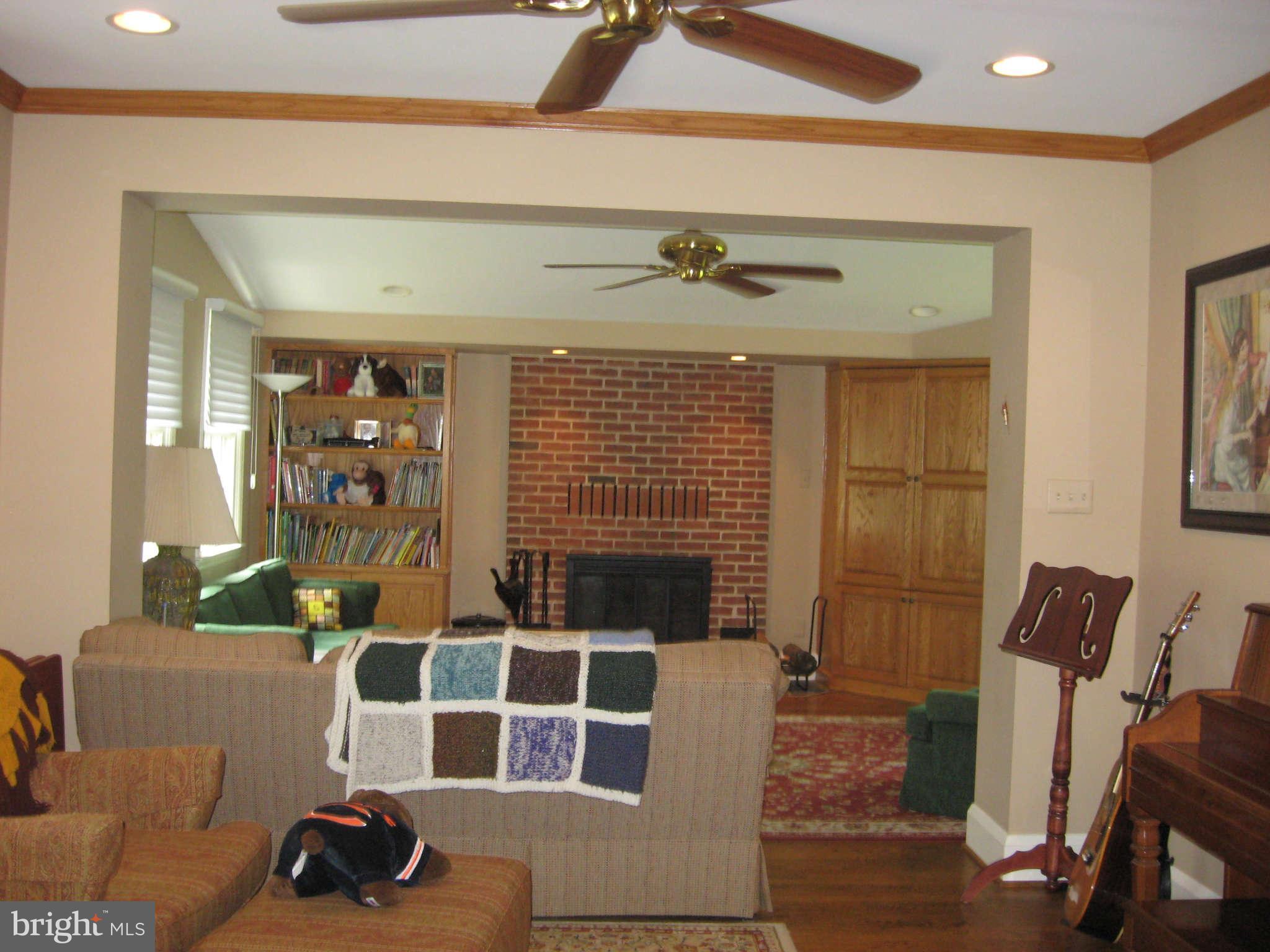 3224 Fallstaff Road Baltimore, MD 21209 - Photo 5 of 17 a living room with furniture a rug and a fireplace