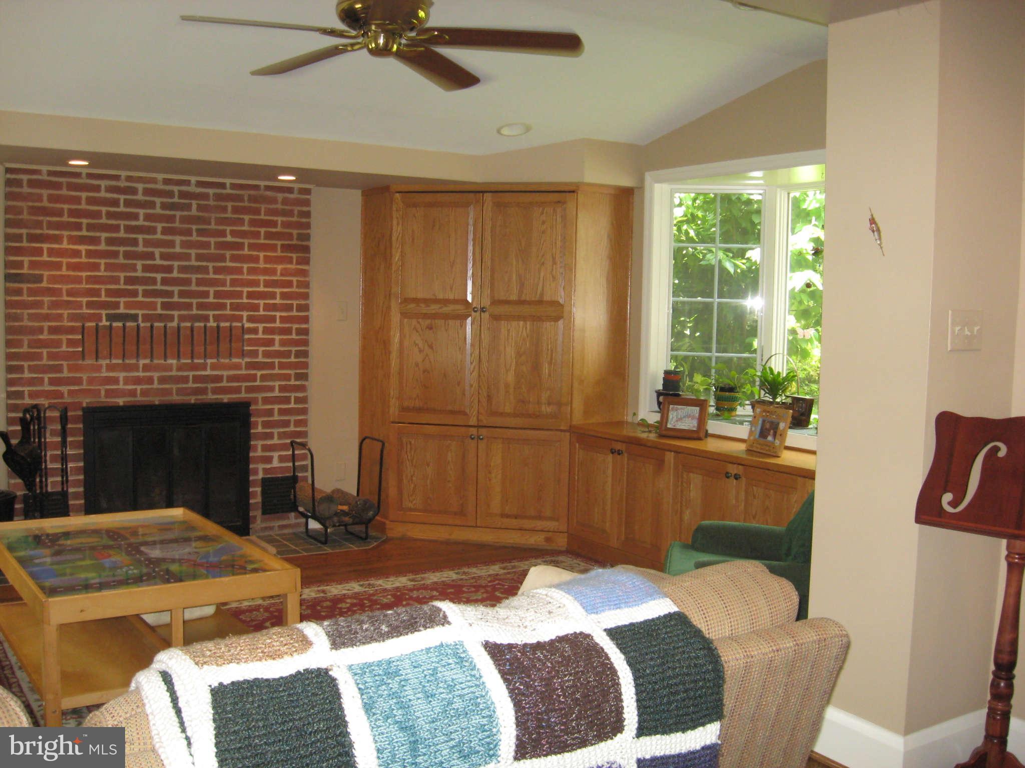 3224 Fallstaff Road Baltimore, MD 21209 - Photo 7 of 17 a bedroom with a bed and a fireplace