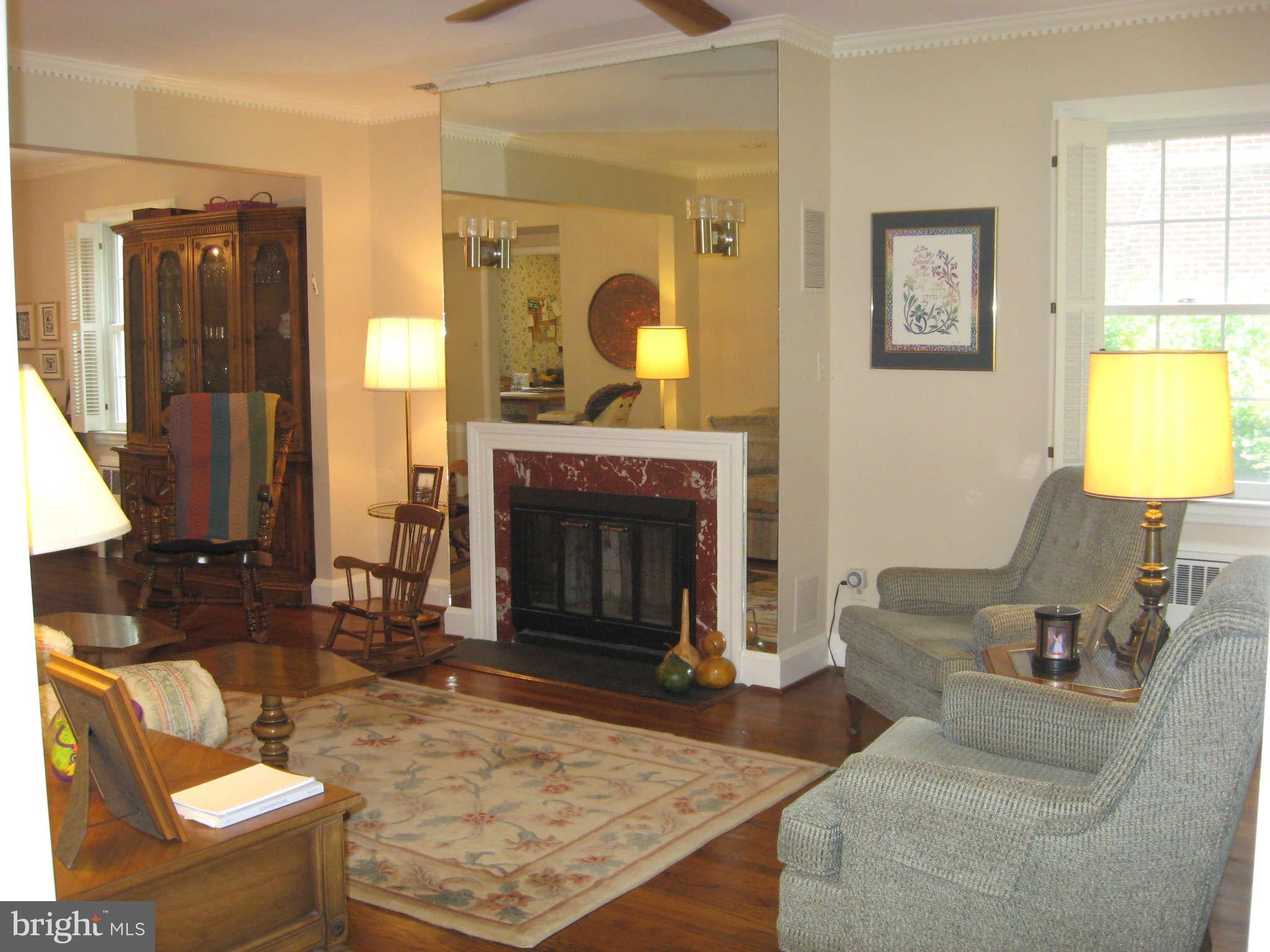 3224 Fallstaff Road Baltimore, MD 21209 - Photo 8 of 17 a living room with furniture and a fireplace