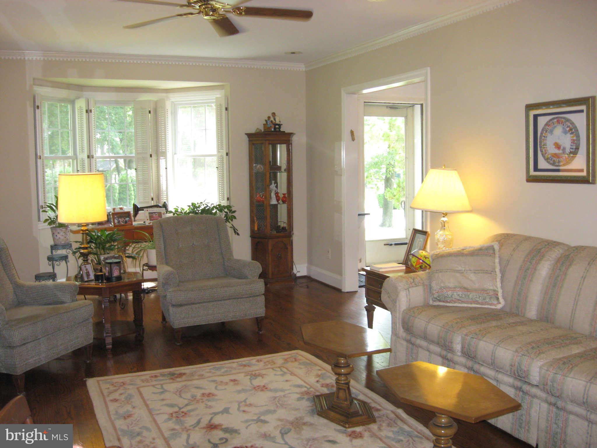 3224 Fallstaff Road Baltimore, MD 21209 - Photo 9 of 17 a living room with furniture and a large window