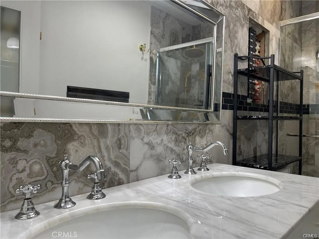 3823 Walnut Grove Avenue Rosemead, CA 91770 - Photo 11 of 28 a bathroom with a granite countertop sink and a mirror