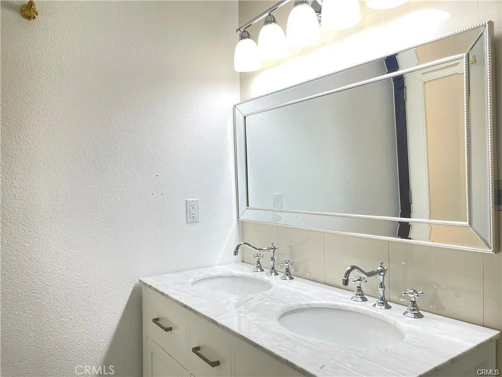 3823 Walnut Grove Avenue Rosemead, CA 91770 - Photo 20 of 28 a bathroom with a granite countertop sink and a mirror