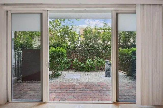 a view of a pathway both side of the house