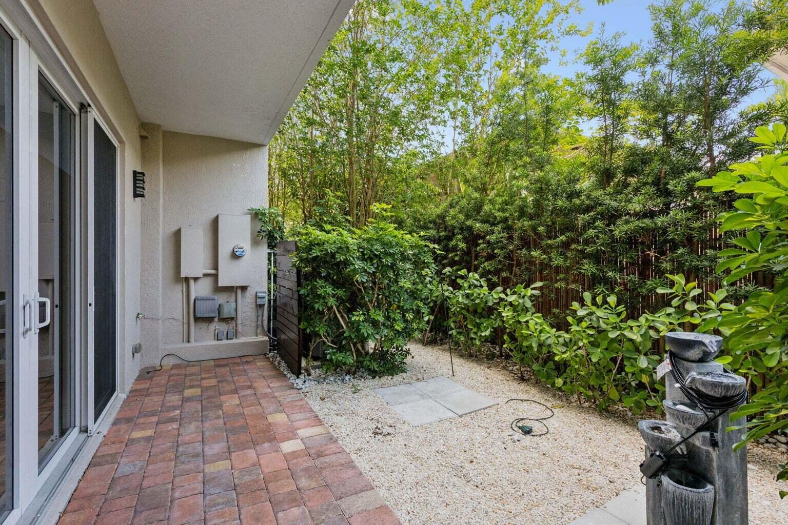 3873 Northeast 22nd Way Lighthouse Point, FL 33064 - Photo 13 of 43 a view of a pathway both side of the house