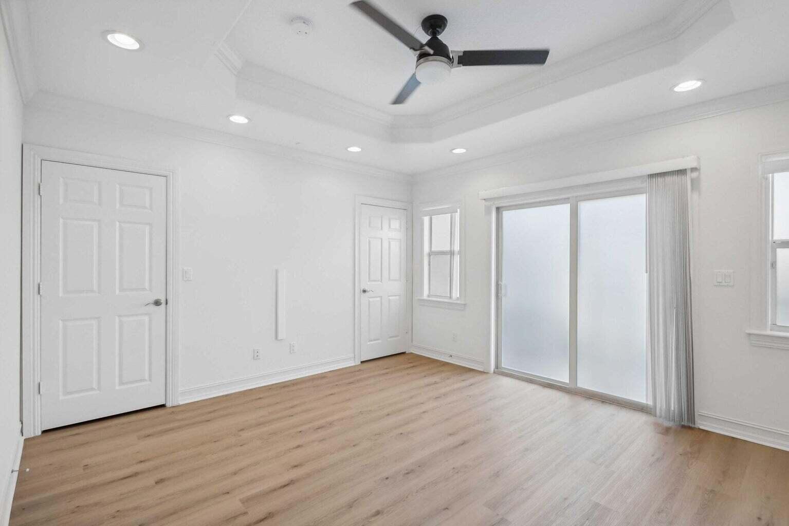 3873 Northeast 22nd Way Lighthouse Point, FL 33064 - Photo 24 of 43 wooden floor in an empty room with a window