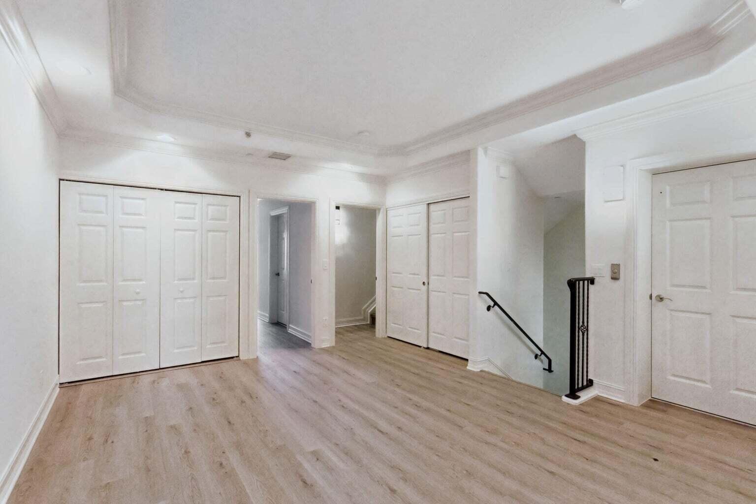 3873 Northeast 22nd Way Lighthouse Point, FL 33064 - Photo 33 of 43 an empty room with wooden floor and entrance