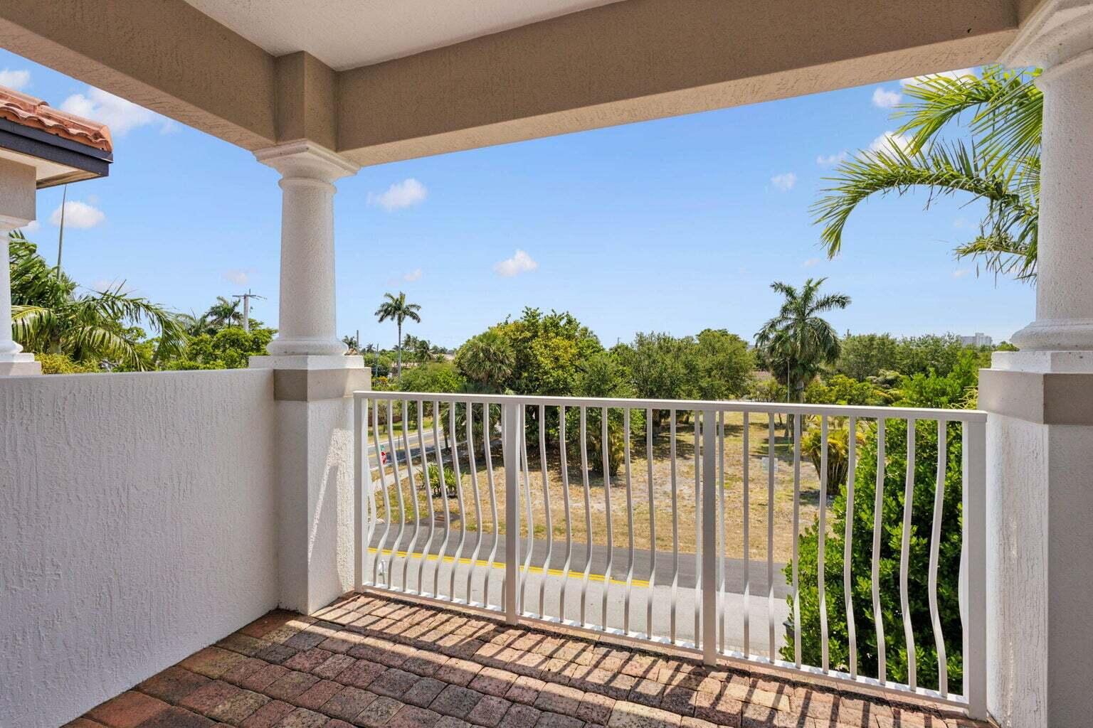 3873 Northeast 22nd Way Lighthouse Point, FL 33064 - Photo 35 of 43 a view of a balcony with wooden floor