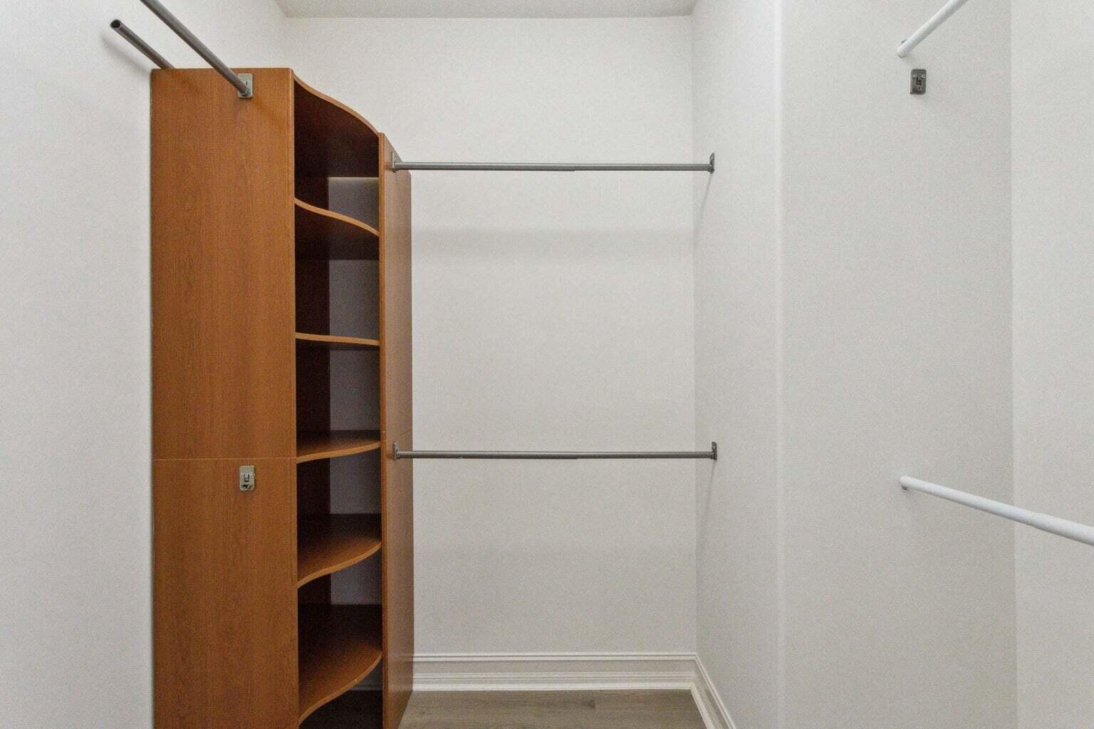 3873 Northeast 22nd Way Lighthouse Point, FL 33064 - Photo 37 of 43 a view of walk in closet with empty racks