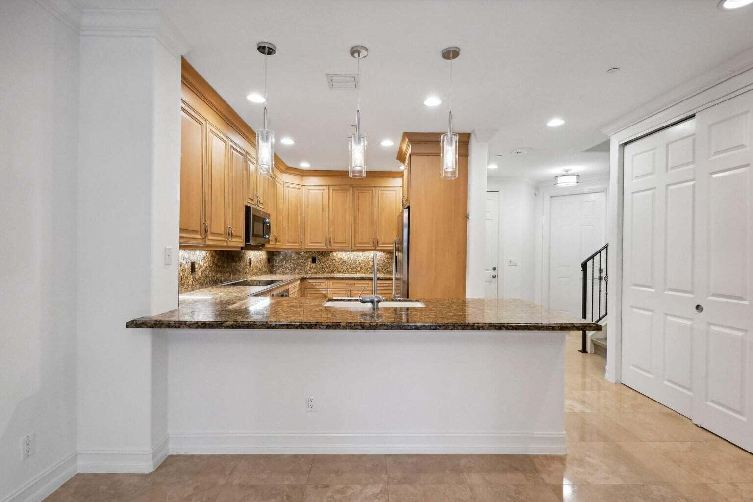 3873 Northeast 22nd Way Lighthouse Point, FL 33064 - Photo 5 of 43 a large bathroom with a large mirror and a shower