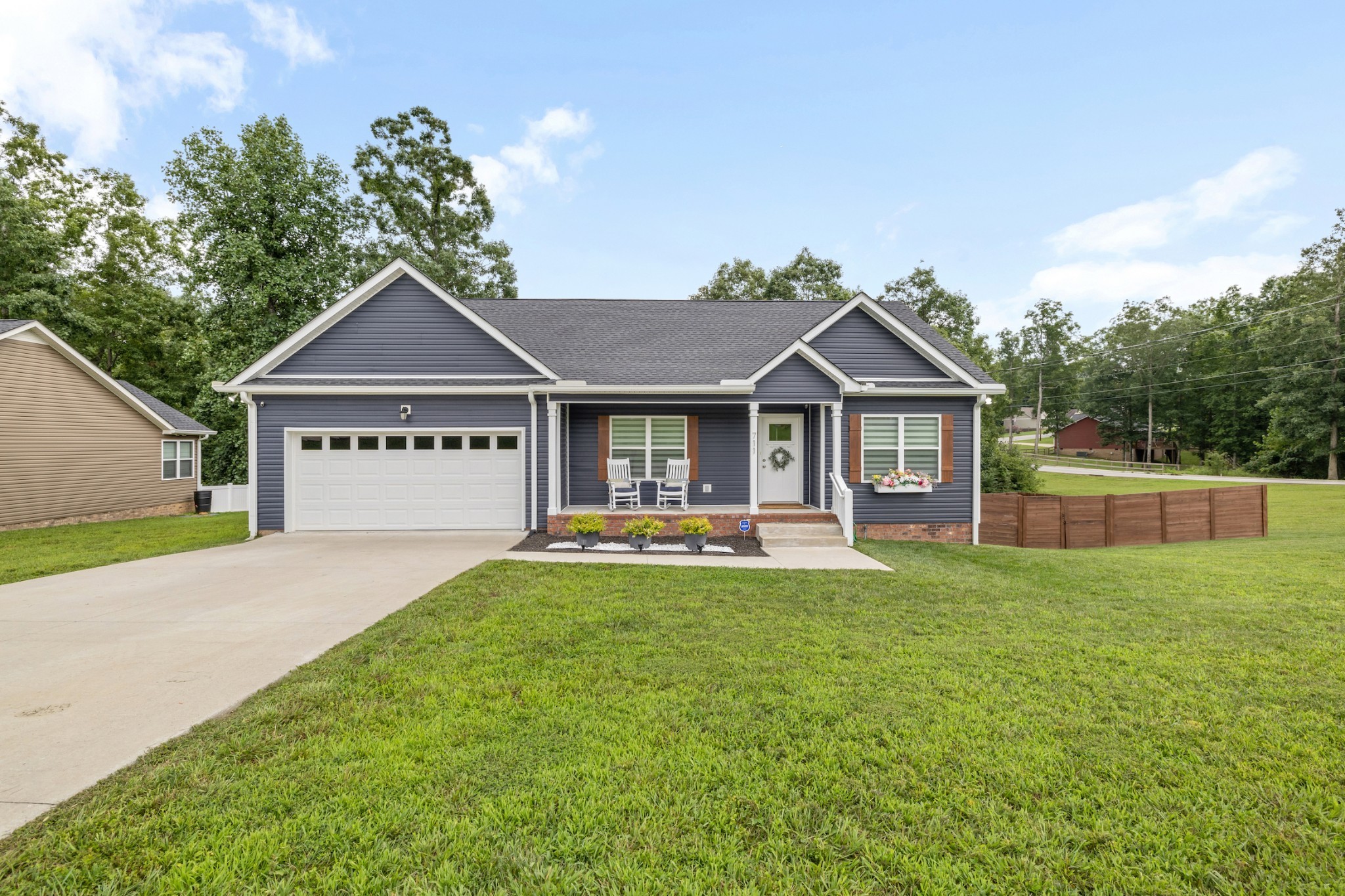 711 Ruby Way White Bluff, TN 37187 - Photo 1 of 24 a front view of a house with swimming pool having outdoor seating