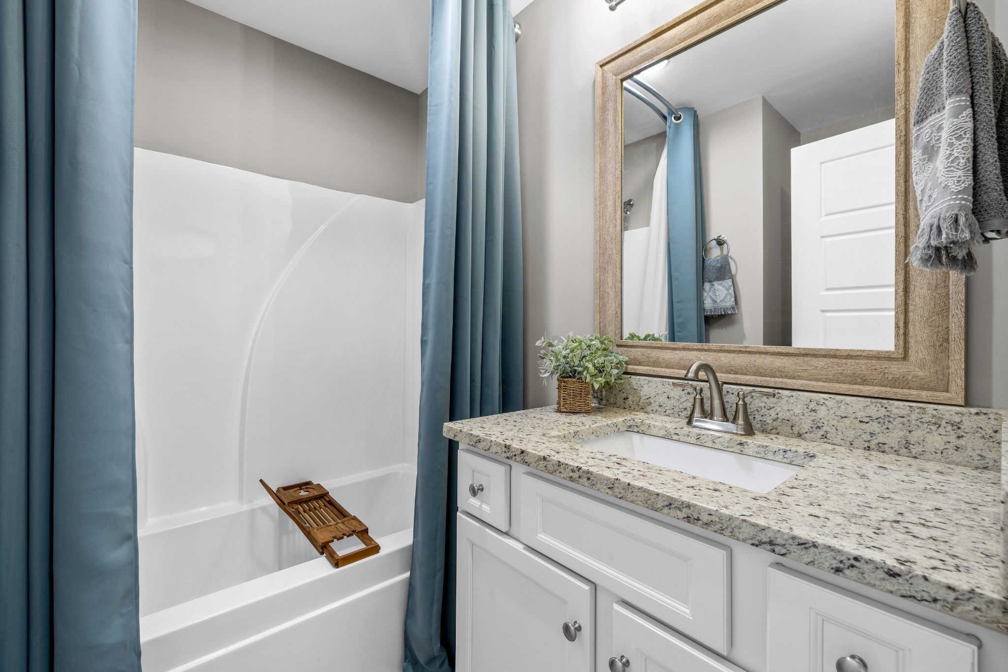 711 Ruby Way White Bluff, TN 37187 - Photo 16 of 24 a bathroom with a granite countertop sink and a mirror