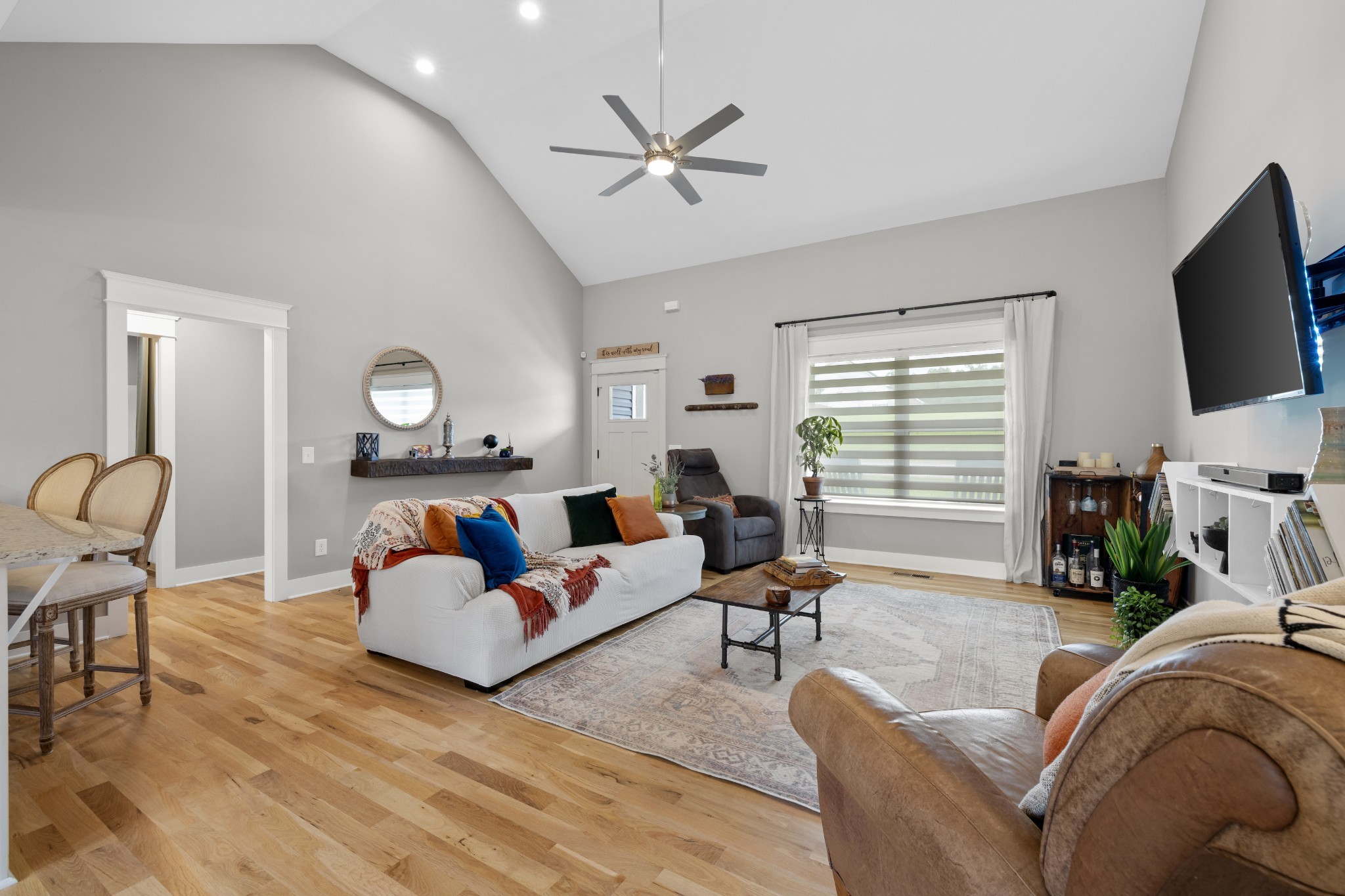 711 Ruby Way White Bluff, TN 37187 - Photo 4 of 24 a living room with furniture and a flat screen tv with wooden floor