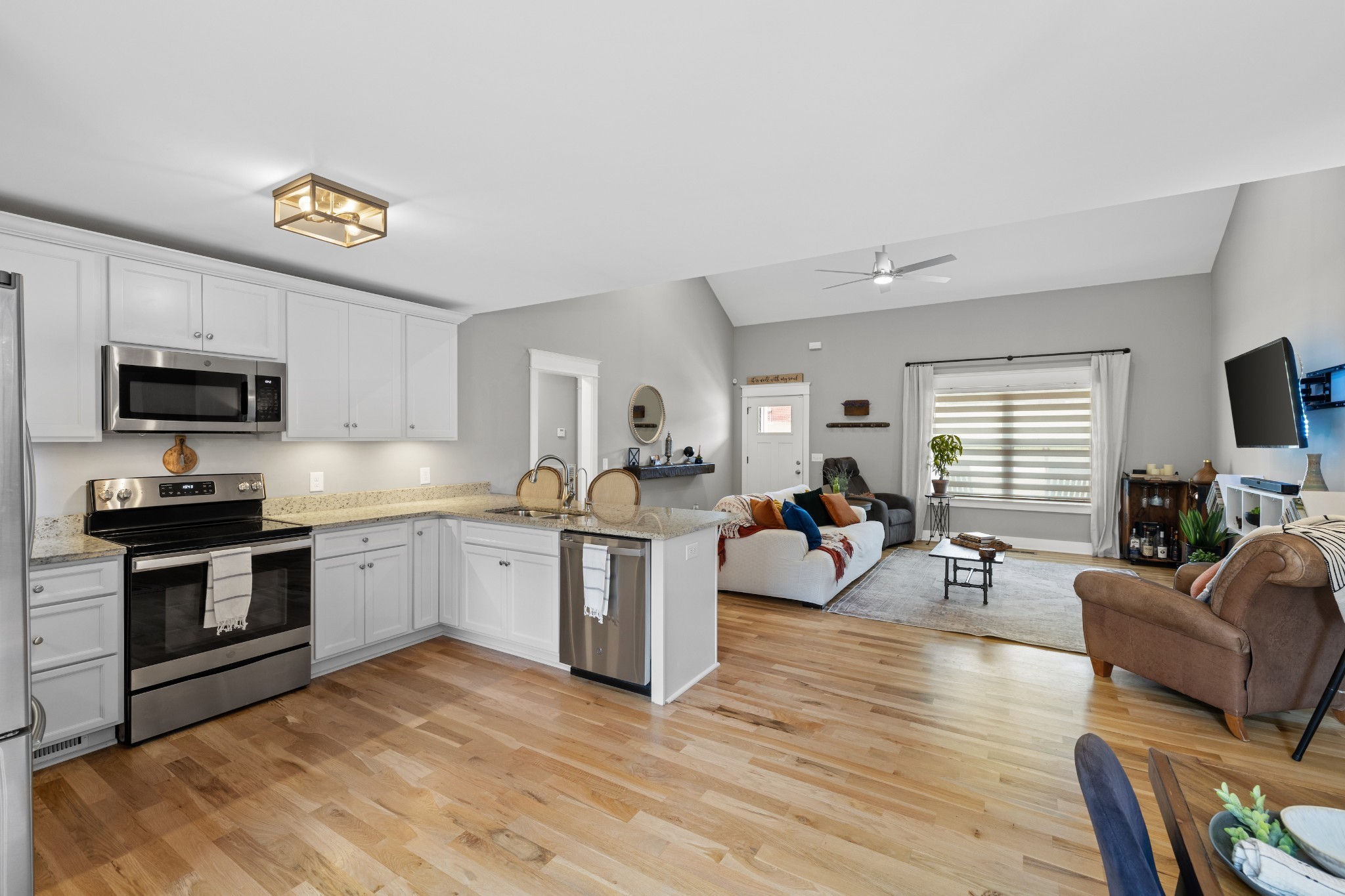 711 Ruby Way White Bluff, TN 37187 - Photo 8 of 24 a living room with furniture a flat screen tv and wooden floor