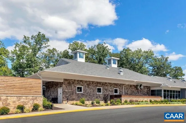 a aerial view of a house a swimming pool and outdoor seating
