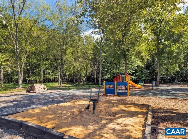 a view of a park with swings and slides
