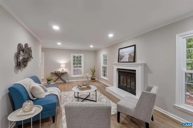 a living room with furniture a fireplace