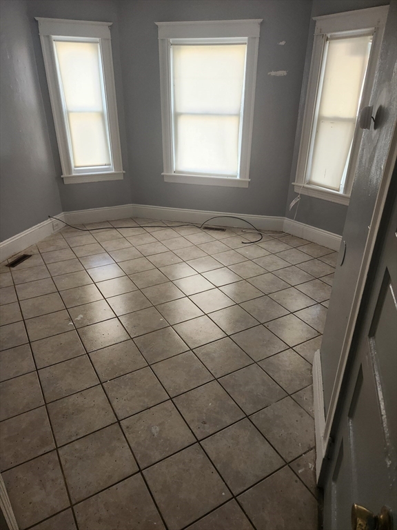 59 Banks Street, Unit 1 Brockton, MA 02302 - Photo 6 of 6 a view of a window and entryway in a room