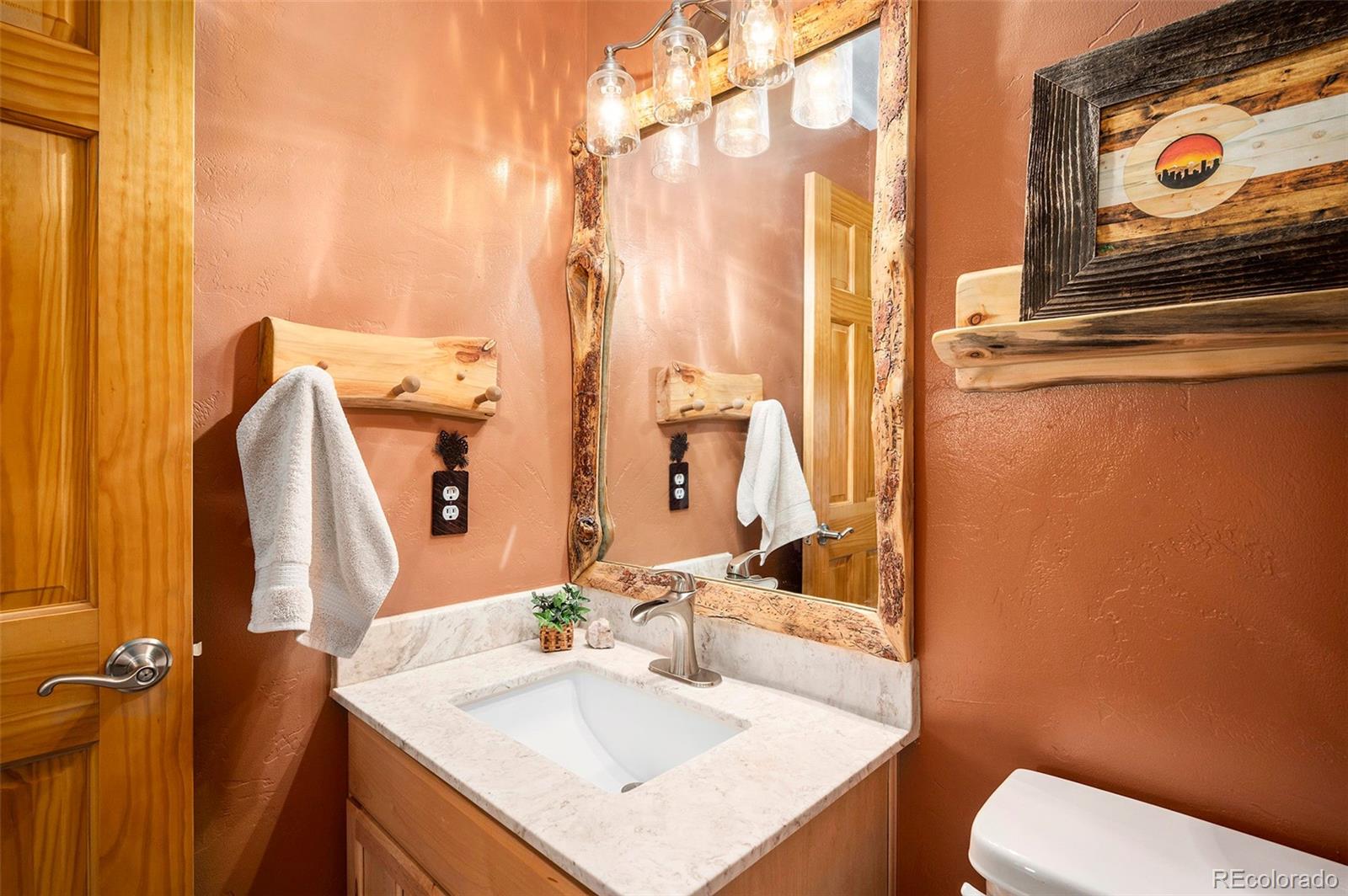 290 Village Road Granby, CO 80446 - Photo 15 of 45 a bathroom with a sink and a mirror