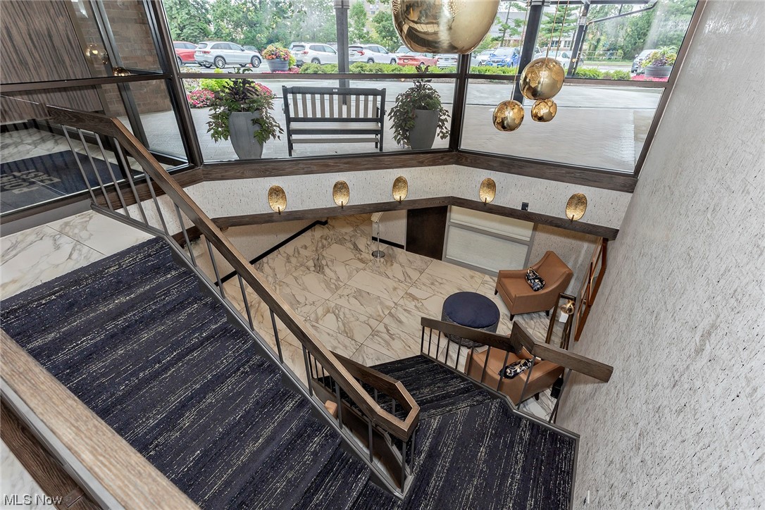 27500 Cedar Road, Unit 608 Beachwood, OH 44122 - Photo 28 of 34 Staircase off the lobby leading to the lower level parking garage.