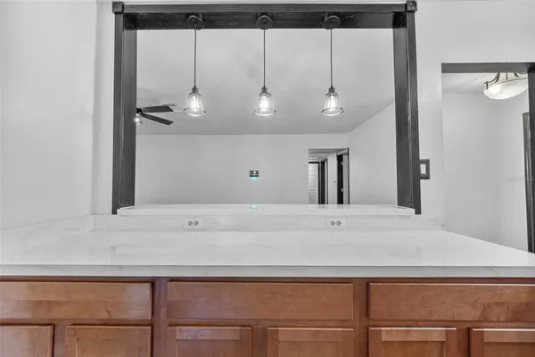 a kitchen with stainless steel appliances granite countertop a sink and a window