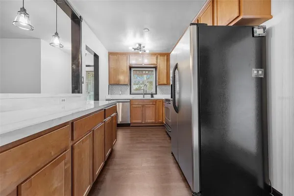 a view of an empty room with a window