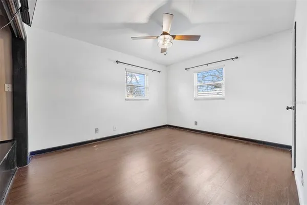 a bathroom with a shower and mirror