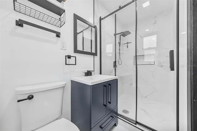 a view of a house with a yard and a garage