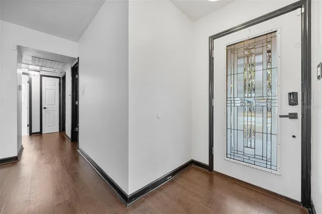 aerial view of a house with a yard and a potted plant