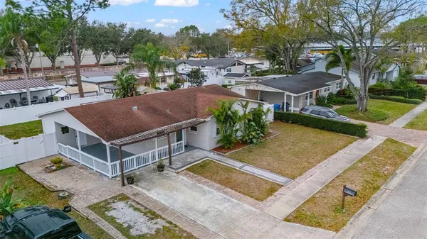 an aerial view of a houses with a lake view