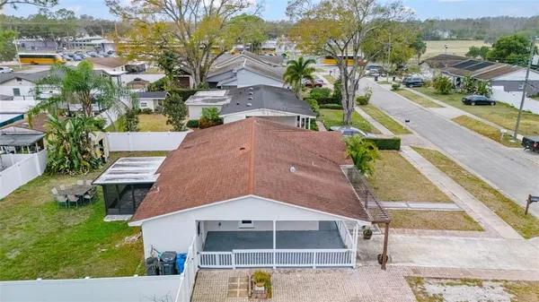 an aerial view of residential houses with outdoor space