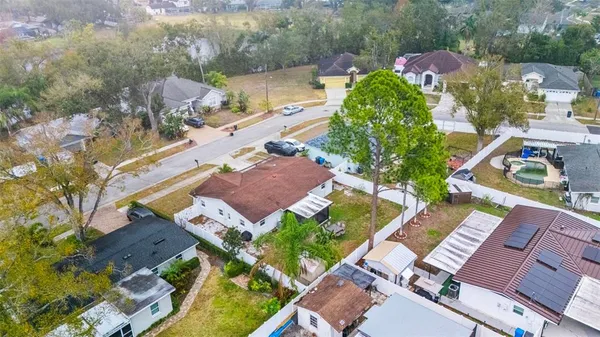 an aerial view of residential houses with outdoor space