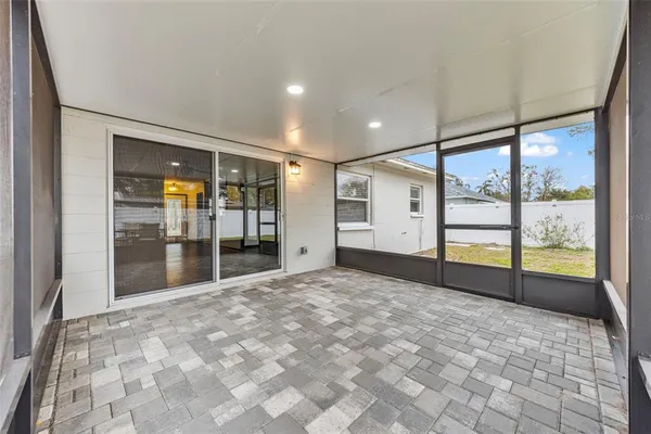a view of a livingroom with wooden floor and a window