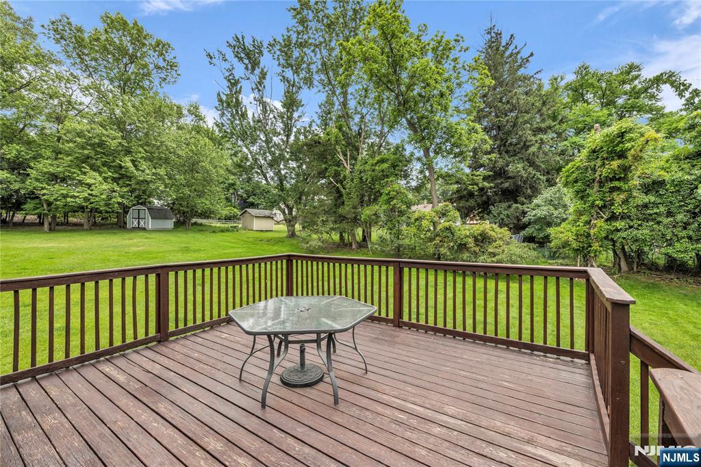 23 Ridge Court Cedar Grove, NJ 07009 - Photo 35 of 37 a view of a deck with wooden floor and fence