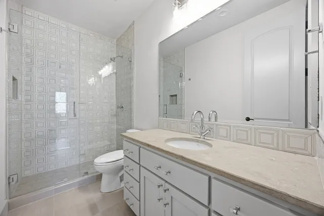 a bathroom with a bathtub sink and mirror