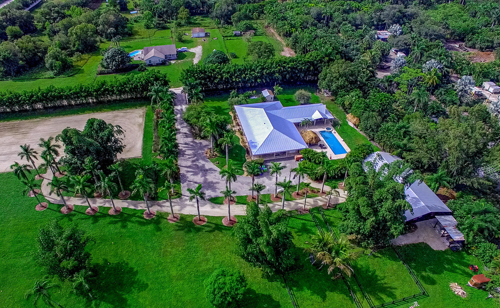 an aerial view of house with swimming pool outdoor seating and yard
