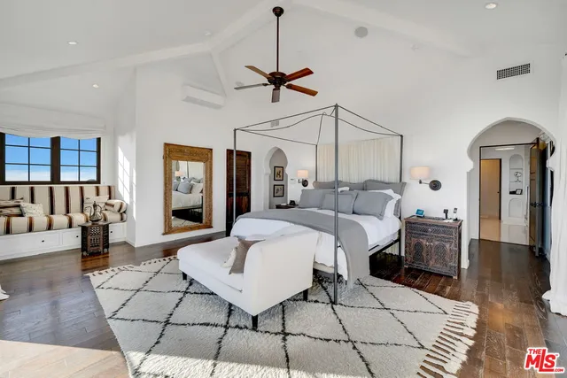 a living room with furniture and large window