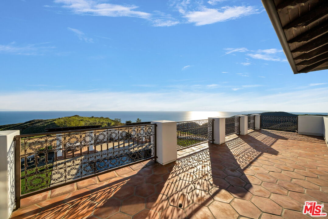 9785 Deer Creek Road Malibu, CA 90265 - Photo 28 of 75 a view of balcony with wooden floor