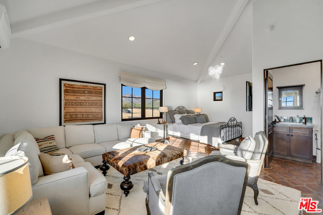 9785 Deer Creek Road Malibu, CA 90265 - Photo 32 of 75 a living room with furniture and large window