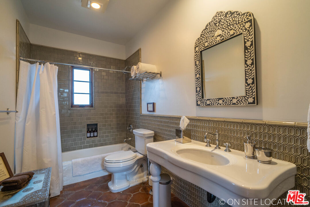 9785 Deer Creek Road Malibu, CA 90265 - Photo 35 of 75 a bathroom with a sink toilet and shower