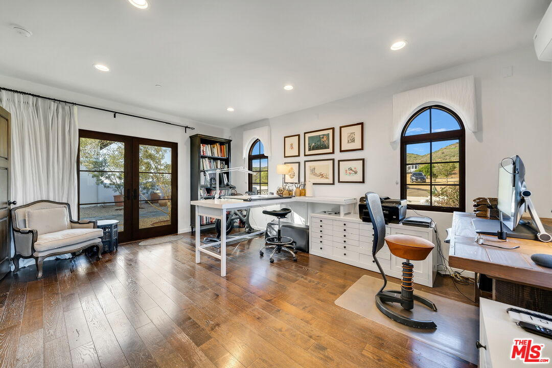 9785 Deer Creek Road Malibu, CA 90265 - Photo 36 of 75 a living room with furniture and wooden floor